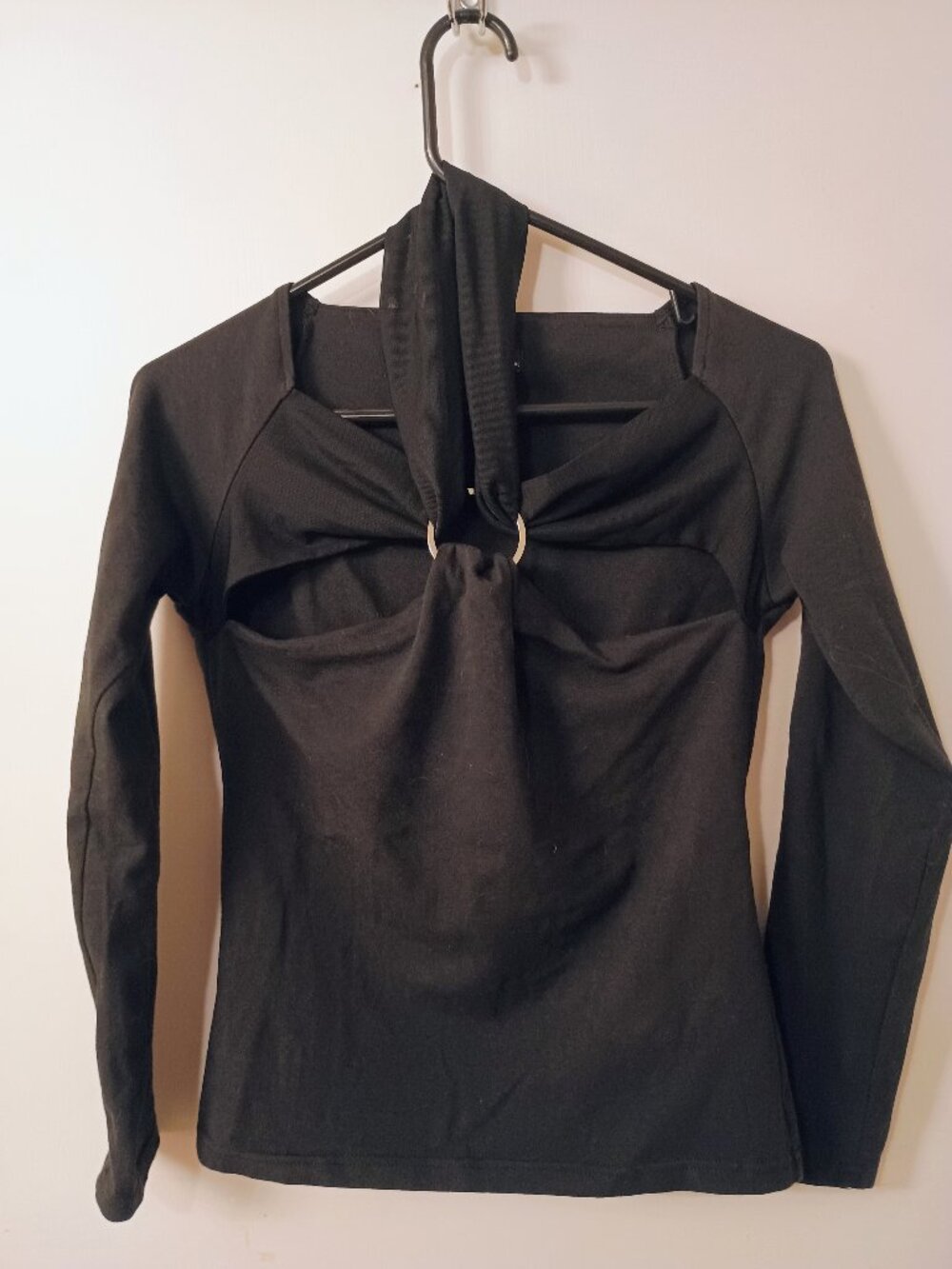 Moda International black long sleeve top with hardware and cutouts, Size M